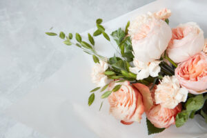 Closeup of bouquet of roses for giving as gift or present. Bouquet of roses represented over white background. Woman's Day concept.